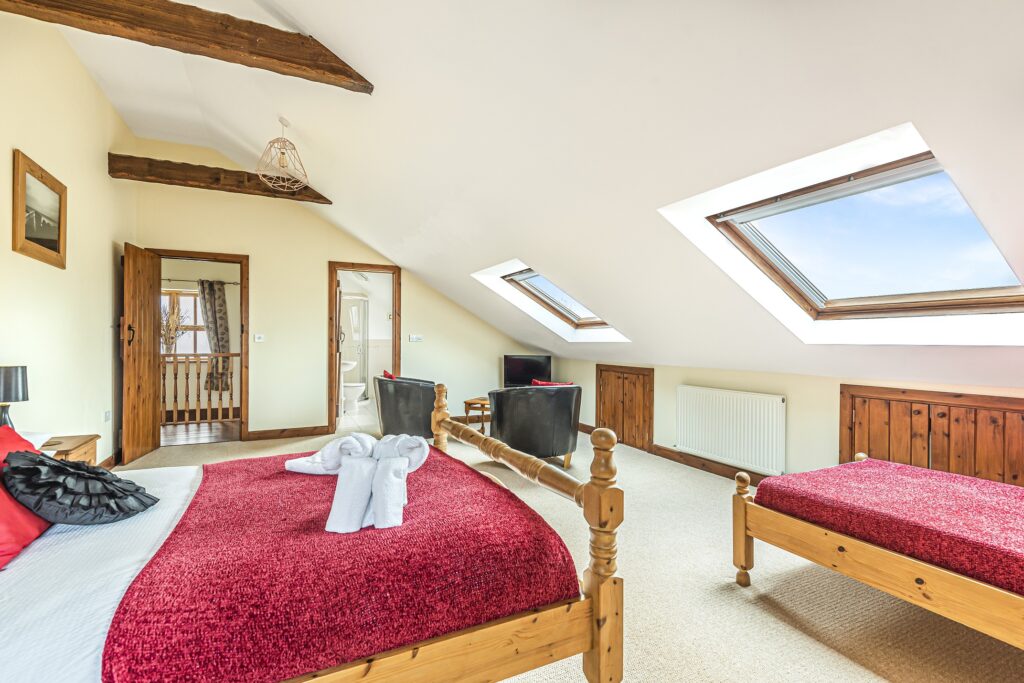 South facing bedroom with king and single bed and ensuite